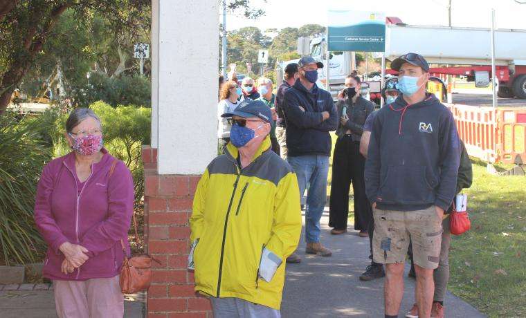 Members of the public queue for their COVID vaccinations at the Wonthaggi Town Hall today.