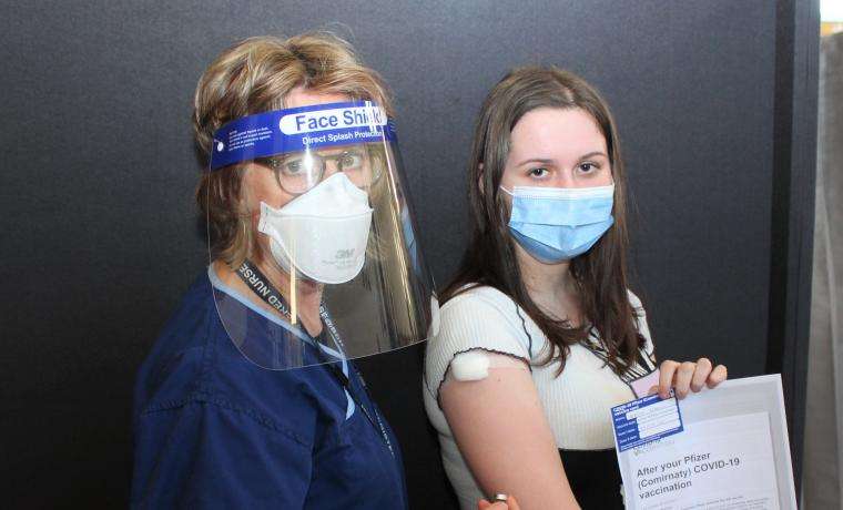 Bass Coast Health Registered Nurse Jenny FitzGerald gives a COVID vaccine to Alyssa Vojkovic, a Year 11 student at Wonthaggi Secondary College.