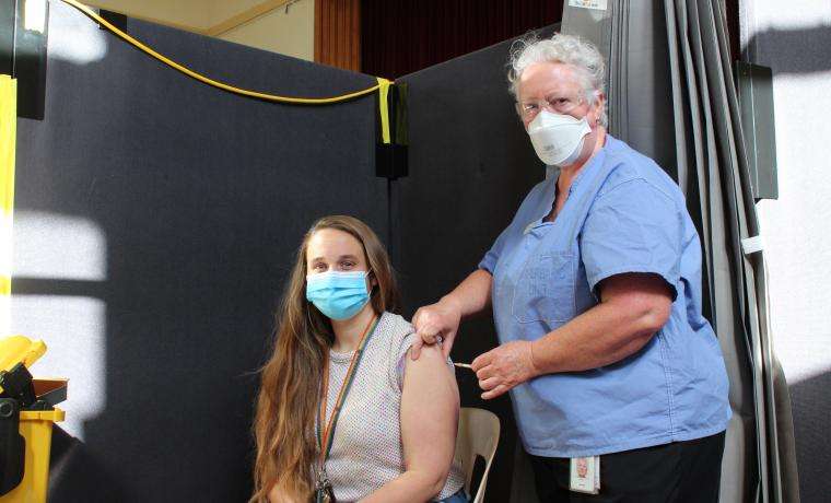 Taegan Holford of Cape Paterson received her COVID vaccine from Bass Coast Health Registered Nurse Janet Luckett at the Community Vaccination Clinic at Wonthaggi Town Hall.