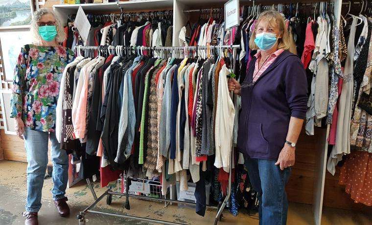 Volunteers at the Bass Coast Health San Remo Opportunity Shop, Helen and Marj, sort clothes ahead of the op shop’s re-opening.