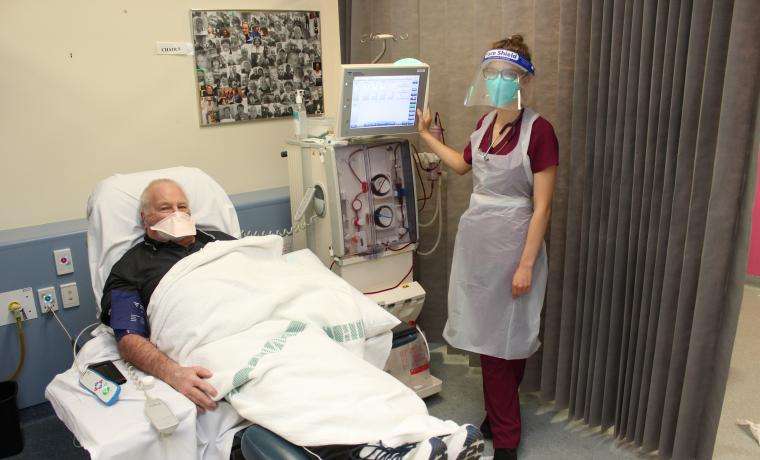 Dialysis patient Donald Mackie continues to receive care from Registered Nurse Emma Darling during the Code Brown.