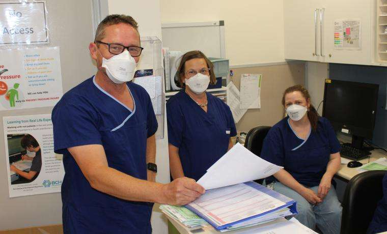 Key members of the Hospital In The Home - COVID Home Monitoring Program are, from left, Nurse Unit Manager Liam Nancarrow and Registered Nurses Claire Plymin and Laura Marshall.