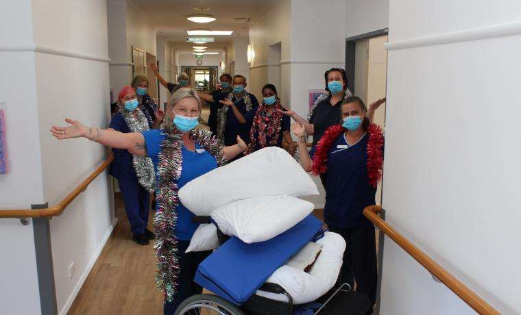 Kirrak House Acting Nurse Unit Manager Kerri Purkis (front) and staff in the renovated hallways of the Wonthaggi aged care home.