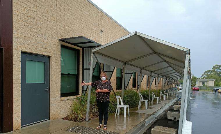 Jo Westthorp points out the location of the COVID Testing Clinic at the Phillip Island Health Hub. 
