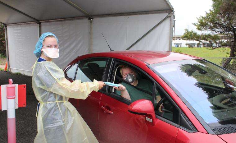 Bass Coast Health’s Lanni Pryor gives a Rapid Antigen Test to Anna Gray of Inverloch.