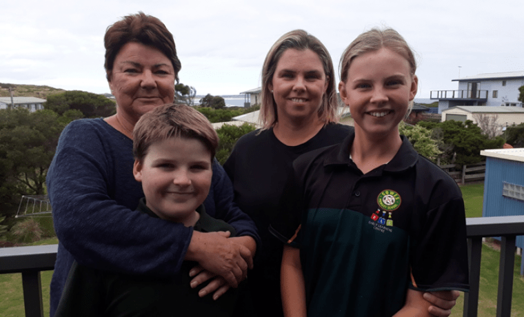 Bass Coast Health Board Director Mim Kershaw with her daughter Emma and grandchildren Lily and Maxi. Mim is urging the community to get vaccinated after personally enduring COVID-19.
