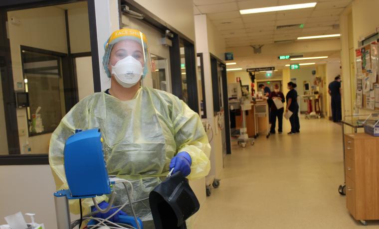 Registered Nurse Maddi Carew dressed in full personal protective equipment for entry into a negative pressure room on Acute Ward at Wonthaggi Hospital, where patients with COVID and other respiratory illnesses are treated.