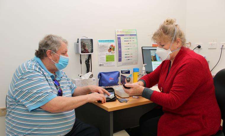 Consumer David Williams consults Bass Coast Health Diabetes Educator Vivienne Prestidge at Wonthaggi Hospital.