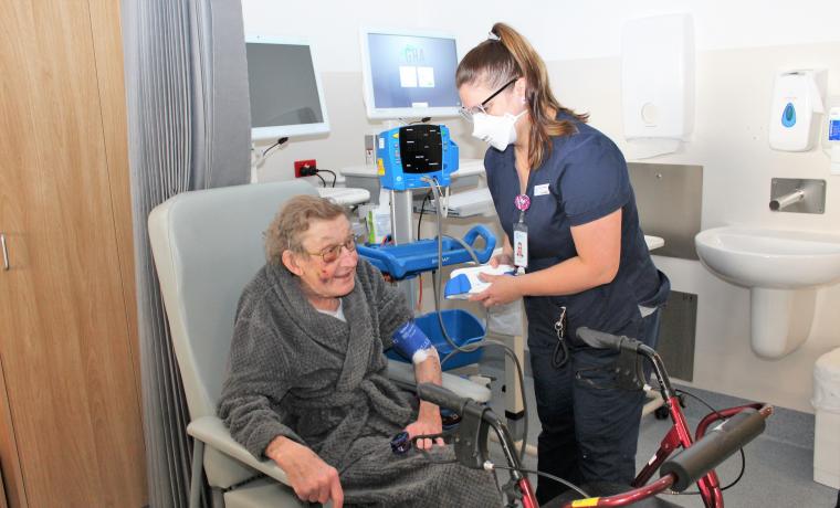 Kassandra Elms, a Registered Nurse in Acute Ward, cares for patient James Boyd.