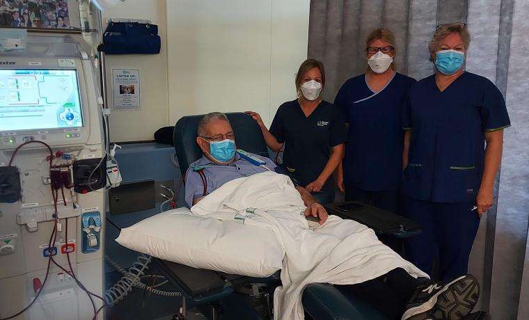 Bass Coast Health Dialysis staff, Nurse Unit Manager Sky Martin, Associate Nurse Unit Manager Michelle Fincher and Registered Nurse Diana Visser with patient Peter Membrey, and the new machine, a Baxter Artis Physio Plus.