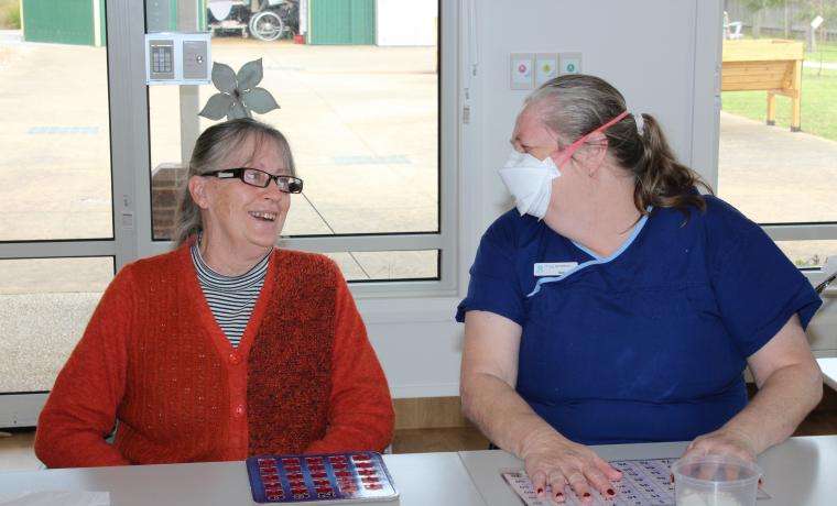 Kirrak House resident Colleen plays bingo with leisure and lifestyle assistant Gai West after the aged care facility passed its three yearly accreditation review by the Aged Care Quality and Safety Commission.