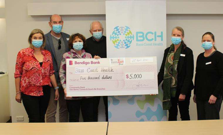 Members of The KernArt Prize at left, Mandy Taylor, Adam McLeod, Janice Orchard and Rob Parsons present their donation to help children to Bass Coast Health’s Kristen Yates-Matthews and Sally Phillips.