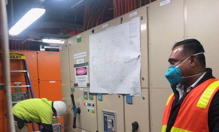 Bass Coast Health Facilities Director Wimal Kirinde inspects the new switchboard installed during the power outage.