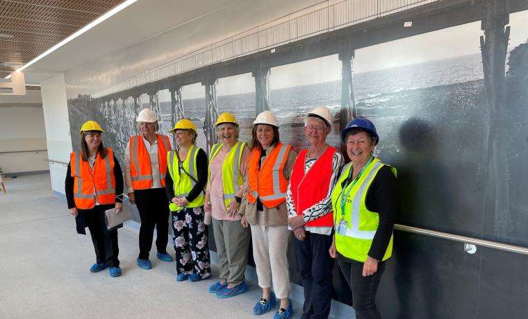 Bass Coast Health’s Community Advisory Committee members and staff review wayfinding in the second floor corridor of the Wonthaggi Hospital Expansion that leads to the linkway. In this corridor, there is a large photo of the famous trestle bridge at Kilcunda. From left: Lynne Winterburn, Paulette Burt, Vicki Riley, Joyce Ball, Louise Sparkes, Hilary Kerrison and Gill Scrase.