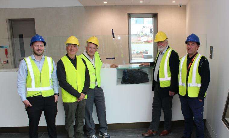 Proudly displaying the coal in the new main reception are, from left, WHE Project Engineer Chris Peterson, Danny Luna, Luciano Storti, Don Paproth and Ken Reid. 