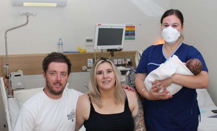 Newly registered Midwife Maddi Carew, right, with baby Kirrah Crook and her parents Bowie Crook and Rachelle Fowler.
