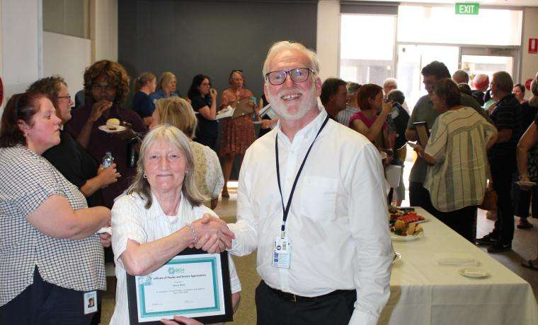 BCH Printing Administrative Assistant Sheryl Mark received her 40 years service award from BCH  Board Chair Ian Thompson