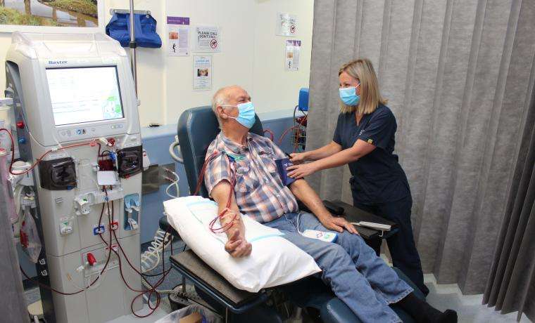 Haemodialysis patient Greg Churchill receives care from Haemodialysis Ward Nurse Unit Manager Sky Martin at Bass Coast Health.