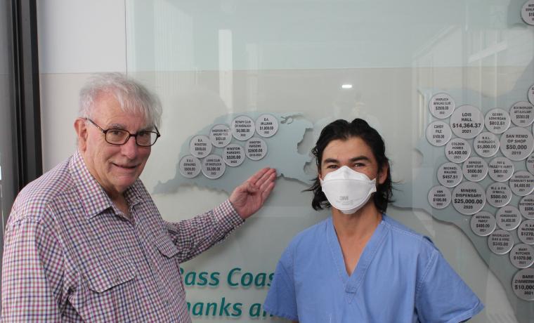 Winston Parsons, a donor to Bass Coast Health, with Registered Nurse David Chun and the donor board at L. Rigby Centre at Wonthaggi Hospital displaying Mr Parson’s donor badge.