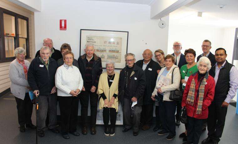 Members of the Wonthaggi Historical Society, historian Sam Gatto and Bass Coast Health CEO Jan Child (centre) with the historic plans on display at Wonthaggi Hospital.