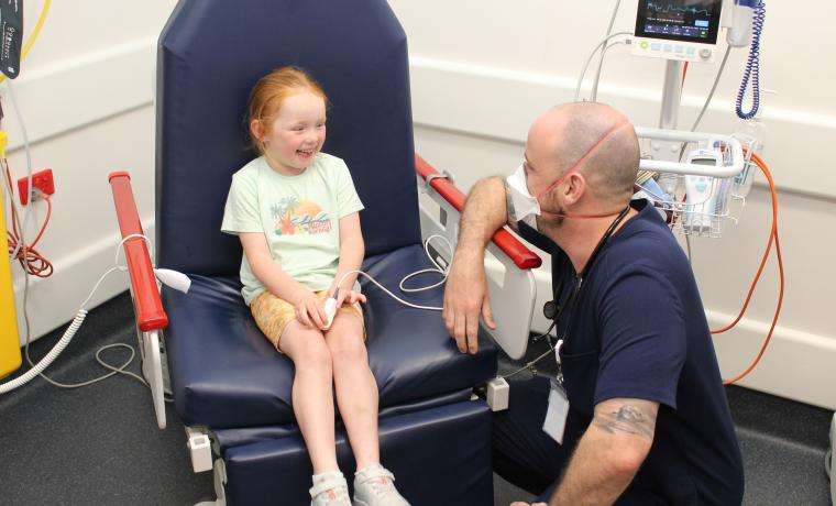 Registered Nurse Scott Fuller helps Charlotte Tedge feel relaxed after she presented to the Emergency  Department at Wonthaggi Hospital for treatment.