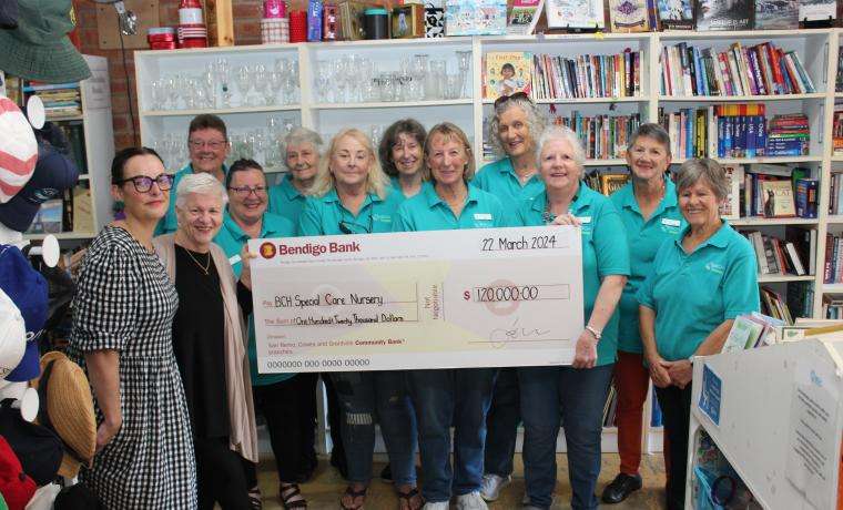 Bass Coast Health Operations Director Jess Jude and CEO Jan Child receive the $120,000 cheque from San Remo Opportunity Shop volunteers, from left, Judi Leece, Tricia Jebson, Nancy Brain, Lorraine Ingbritsen, Janine Morris, Marj Wagland, Helen Andrews, Joan Ray, Sandra Thorley and Caroline Talbot.