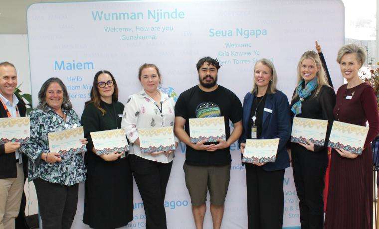Members of Bass Coast Health’s Reconciliation Action Plan Working Group with copies of the plan, from left, Steve Fuery, Jane Ori, Jess Jude, Fiona Christensen, Dion Triptree, Kristen Yates-Matthews, Lauren O’Dwyer and Interim CEO Simone Alexander. Absent: Darelle Van Haaster, Aunty Doseena Fergie and Hope Thomas. 