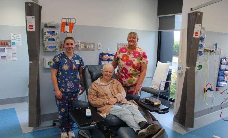 Graduate Nurse Tarra Funnell and Registered Nurse Linda Tack care for patient Heather Harry while she receives cancer treatment in the L. Rigby Centre at Wonthaggi Hospital.