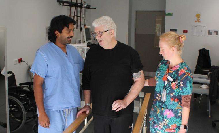 Stroke patient Geoff Chain works through a rehabilitation session with Physiotherapist Kavin Jayasena and Occupational Therapist Abigail Eastick at Armitage House, Wonthaggi Hospital.