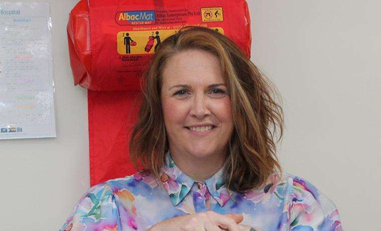 Kelly Amber of Ambling Along Tours and Transfers with the defibrillator at Wonthaggi Hospital’s maternity unit bought with the proceeds of a golf day at Phillip Island Golf Club.