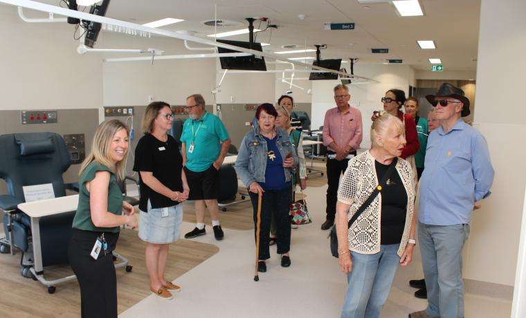 Haemodialysis Nurse Unit Manager Sky Martin, left, shows a tour group through the Dialysis and Chemotherapy shared space.