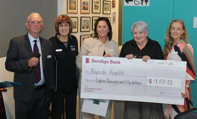 Inverloch Lions Club President, and Inverloch Fundraising Auxiliary member Terry Hall, the Auxiliary’s Kaye Jones, Bayside Health Regional CEO Lou Sparkes, the Auxiliary’s Helen Sutton and Bayside Health Regional Lymphoedema Practitioner Michelle McMahon with the giant cheque for a SOZO machine presented at the Lions Club’s Changeover Dinner.