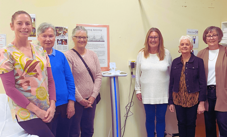 Bayside Health’s Lymphoedema Therapist Aimee Morrison, with members of the Lyrebird Auxiliary (left to right, Joy Robb, Jo Boyd, Lyn Yeomans, Lyndy Elliott and Robyn Powney) and the new SOZO machine at Korumburra Hospital.