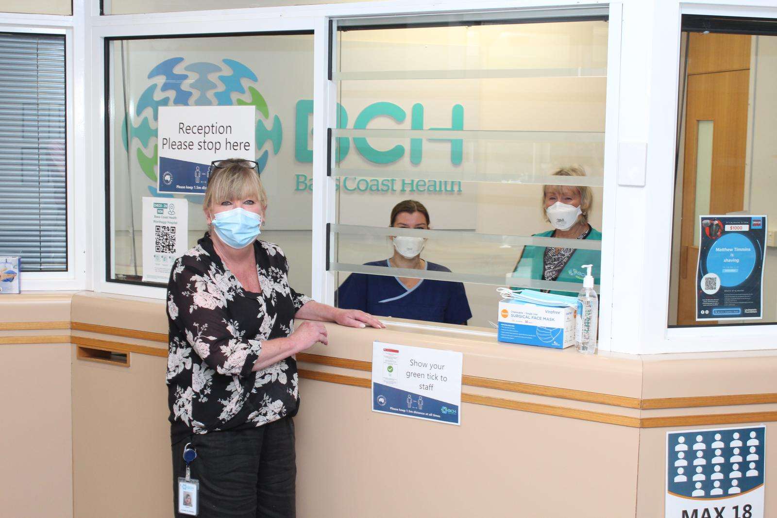 Mandy Gilcrist and a volunteer and employee at main reception