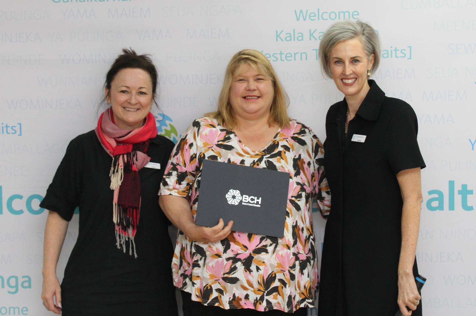 Enrolled Nurse Melinda Milkins, centre, received a 35-year service award from Chief Operating Officer/Director of Nursing Christine Henderson, left, and Interim CEO Simone Alexander.