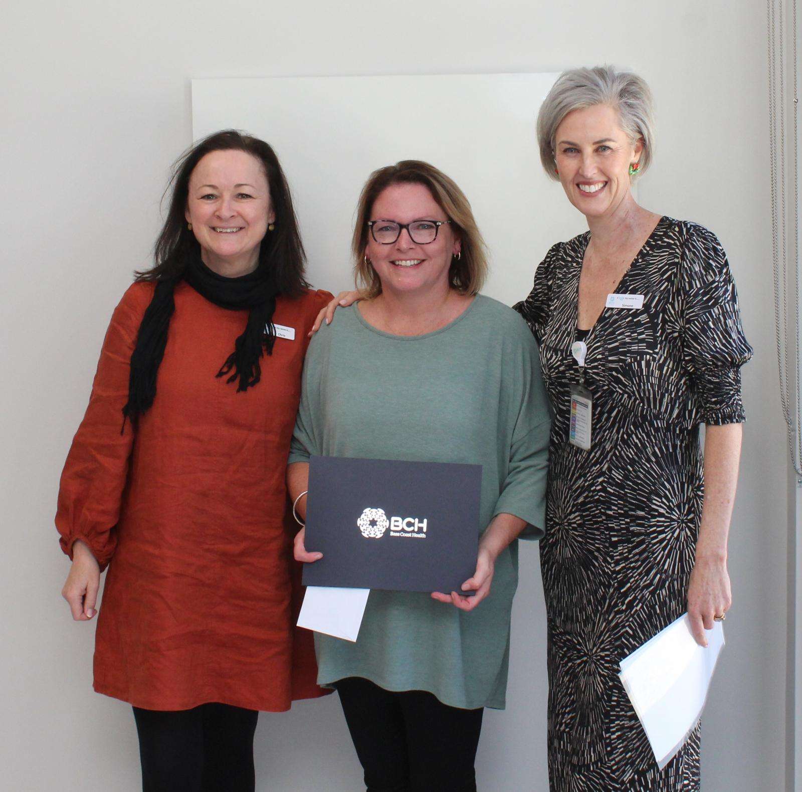Executive Director Kirsten Weinzierl, centre, received a 30-year service award. She’s with Chief Operating Officer/Director of Nursing Christine Henderson, left, and Interim CEO Simone Alexander