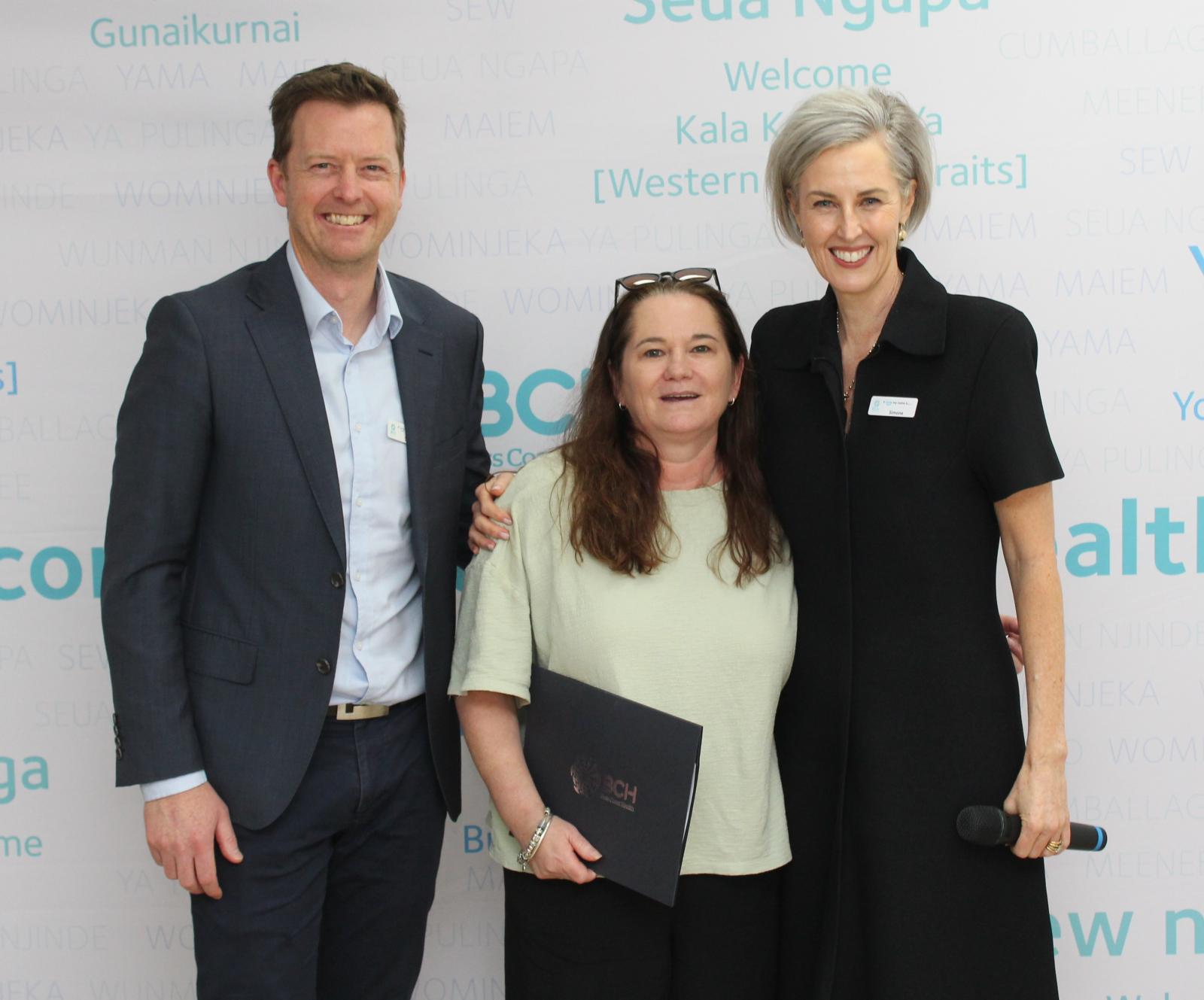 Health Service Coordinator Chris Burns, centre, was recognised for 30 years of service. She’s with Chief Financial Officer Shaun Brooks and Interim CEO Simone Alexander.